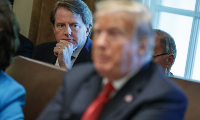 White House counsel Don McGahn looks on as President Donald Trump speaks during a cabinet meeting in the Cabinet Room of the White House, Wednesday, Oct. 17, 2018, in Washington. (AP Photo/Evan Vucci)